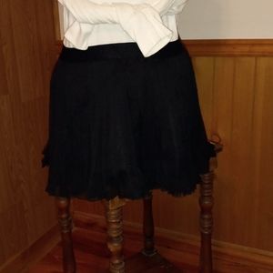 Black pleated mini skirt